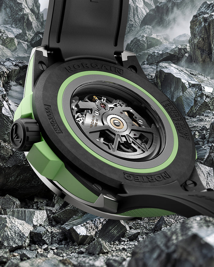 Sapphire display caseback showing mountain-inspired automatic rotor